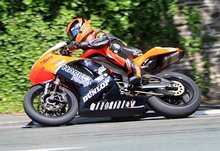 Thumbnail of Ryan Farquhar on his way to a podium finish in the second Relentless Supersport TT in 2008