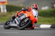 Thumbnail of Ryan Farquhar on the Harker Racing machine during Thursday evening's practice session at the 2008 TT