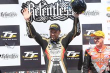 Thumbnail of Bruce Anstey celebrates victory in the second Relentless Supersport TT in 2008