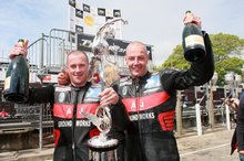 Thumbnail of Nick Crowe and Mark Cox celebrate winning the second Sure Mobile Sidecar TT race in 2008