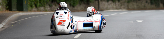 Ben and Tom Birchall at Braddan Bridge on their way to setting a new Sidecar lap record in Sure Sidecar Race 2, TT 2016