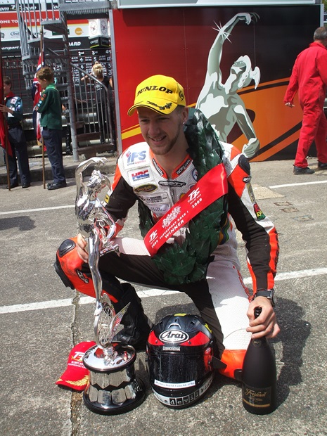 Ian Hutchinson celebrates winning his second Isle of Man TT