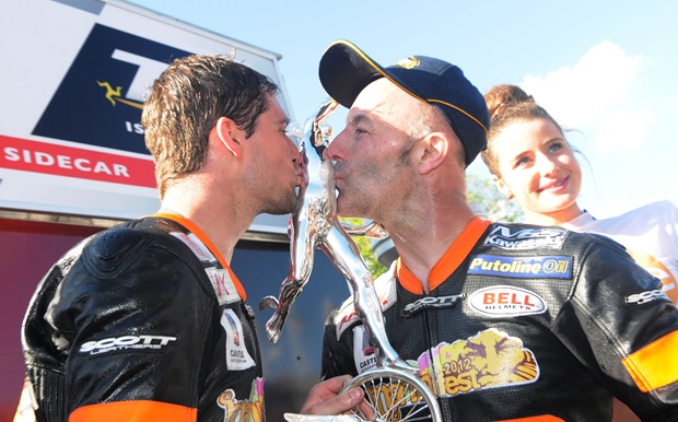 Patrick Farrance and Dave Molyneux celebrate victory in the second 2012 Sure Sidecar TT