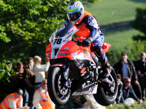 Jamie Hamilton on his KMR Kawasaki jumps Ballagh Bridge during the second Superbike qualifying session at the 2012 Isle of Man TT fuelled by Monster Energy (SIMON PATTERSON/PACEMAKER)