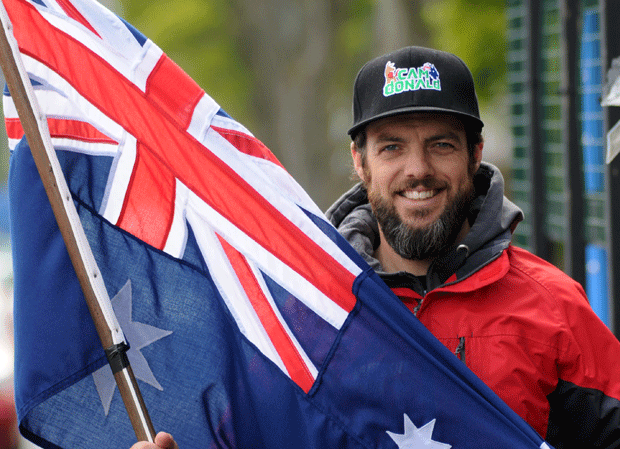 Aussie star Cam Donald holds the national flag 