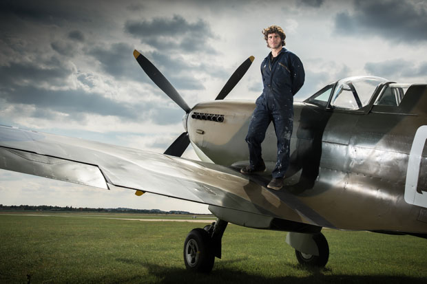 Guy poses with a Spitfire 