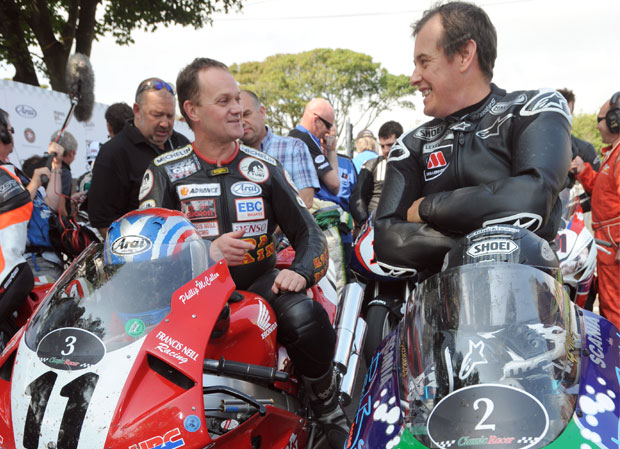 Phillip McCallen and John McGuinness chat after the 2013 Classic Racer Lap of Honour
