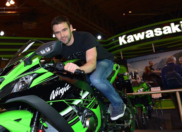 William Dunlop poses with a Kawasaki bike at Motorcycle Live