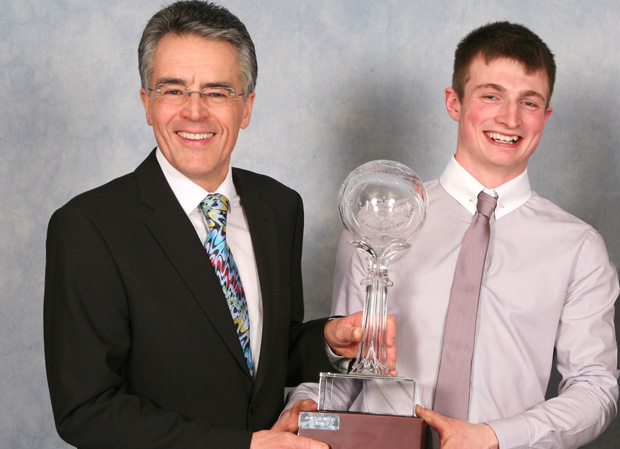 James Cowton receives the Duke Road Race Rankings Trophy from Peter Duke 