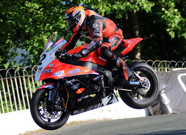 Farquhar leaps Ballaugh Bridge on his Kawasaki superbike