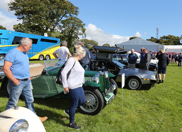 Visitors inspect cars in the 2016 Paddock Carnival Concours d'Elegance