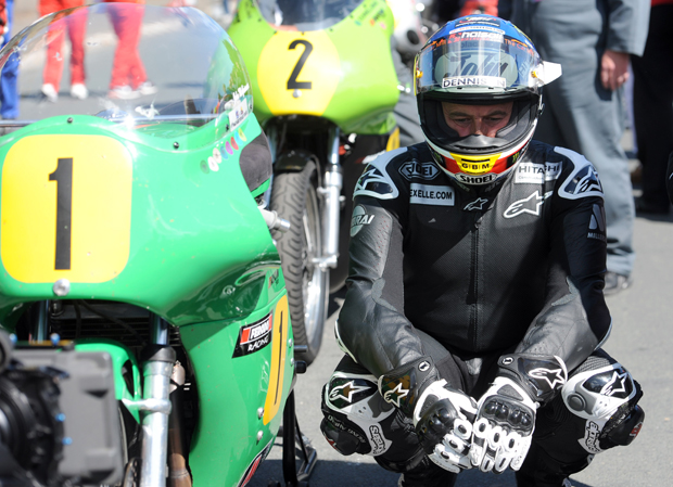 John McGuinness waits by the side of the Winfield Paton for the start of the 500cc Classic TT race
