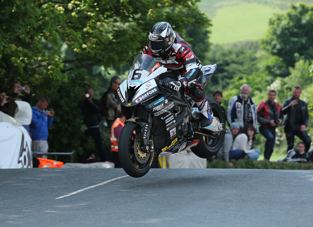 Michael Dunlop jumps Ballaugh Bridge on his way to winning the opening RST SUperbike TT Race in race- and lap record time