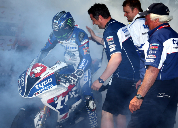 Hutchy does a burn out to celebrate his win in the RL360º Superstock TT - Tim Keeton / Impact Images Photography