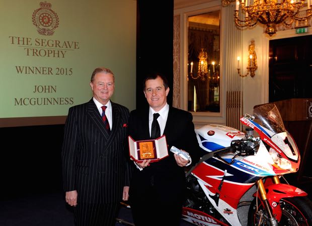 John McGuinness is presented with the coveted Segrave Trophy by Tom Purves, Chairman of the Royal Automobile Club