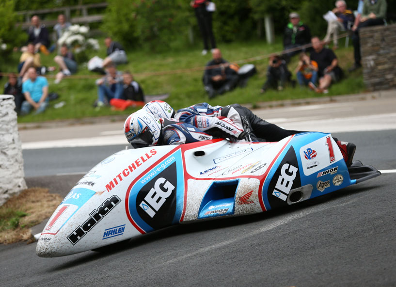 Ben and Tom Birchall rounds Governor's Dip on their way to setting a new sidecar lap and race record.
