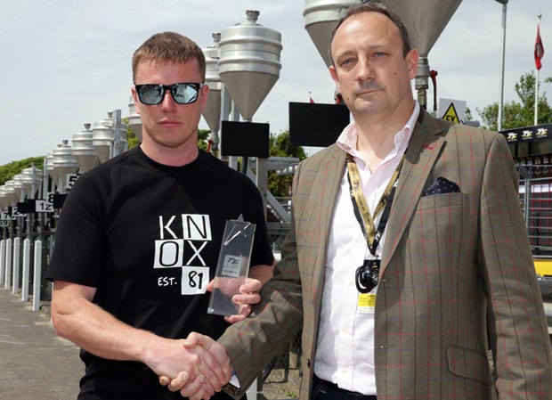 Ryan Kneen receives the PokerStars Spirit of the TT Award from Guy Templer, of the Stars Group
