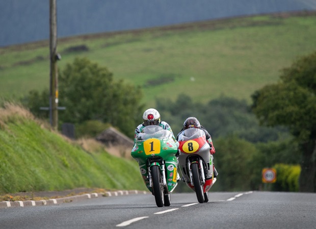 John McGuinness chased by Dominic Herbertson up Lambfell in qualifying. Photo: Tony Goldsmith