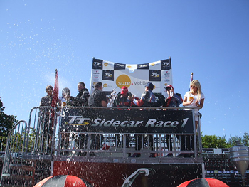 Podium celebrations after the first Sure Mobile Sidecar TT