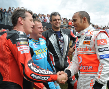 TT hero John McGuinness (left) chats with British Formula One star Lewis Hamilton (right) at Goodwood (LAT Photographic)