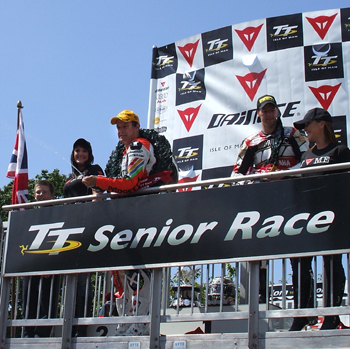 John McGuinness, pictured celebrating victory in the 2008 Senior TT, will be back in 2009