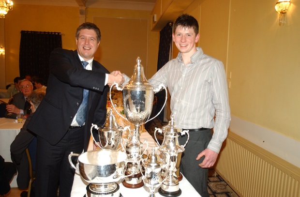 Graham Eden of Petrochem Carless (left) congratulates Dan Kneen on the silverware collected for his feats in 2008 (John Watterson/Isle of Man Newspapers)