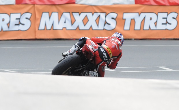 Trackside banners are prominent at the TT