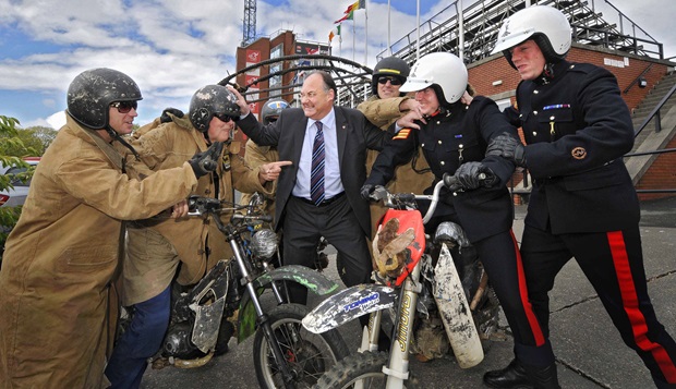 Isle of Man Tourism political member Geoff Corkish tries to keep the Purple Helmets and White Helmets part