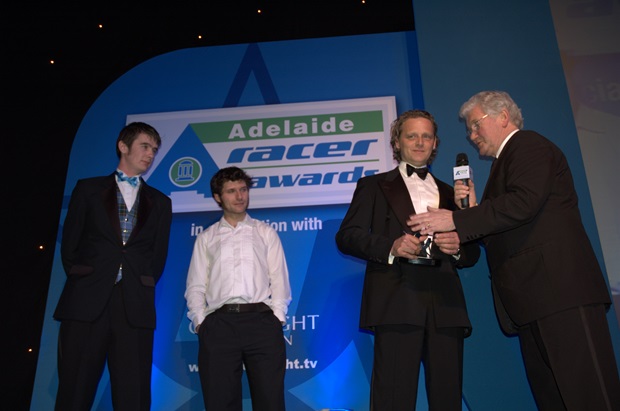 Conor Cummins and Guy Martin look on as Klaus Klaffenbock recieves his International Achievement Award