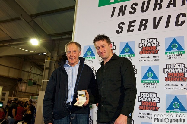 Raymond McCullough hands James McBride his 130mph club medal (Derek Clegg)