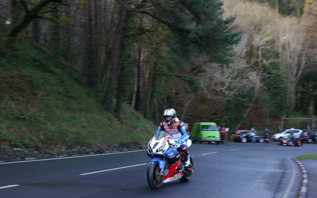 John McGuinness on his number 1 Honda TT Legends machine at Ramsey Hairpin on the Isle of Man TT course