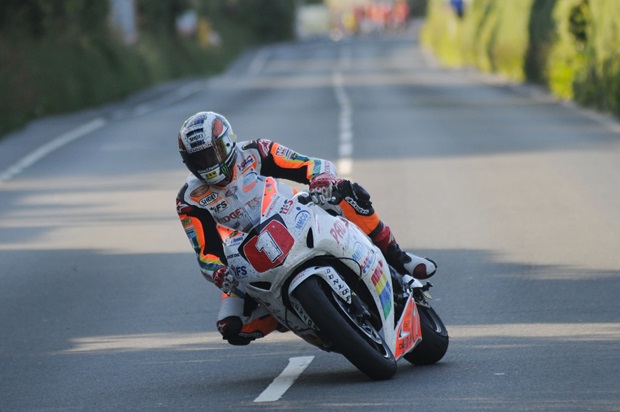 John McGuinness on his way to victory in the 2012 Royal London 360 Superstock TT race