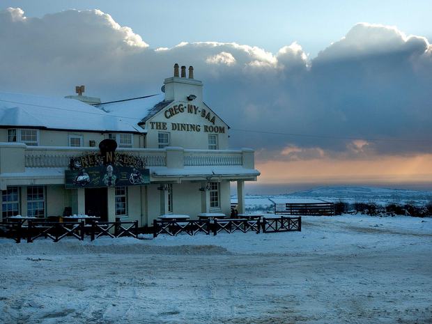 Snow at Isle of Man TT landmark the Creg-ny-Baa