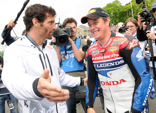 Mark Webber and John McGuinness in a media scrum