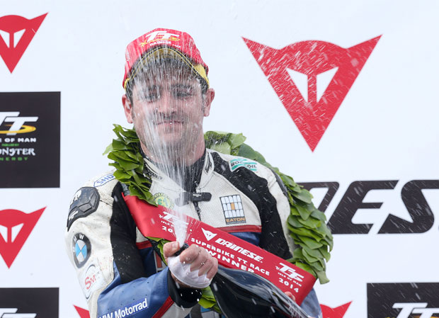 Michael Dunlop sprays the champagne on winning the 2014 Senior TT