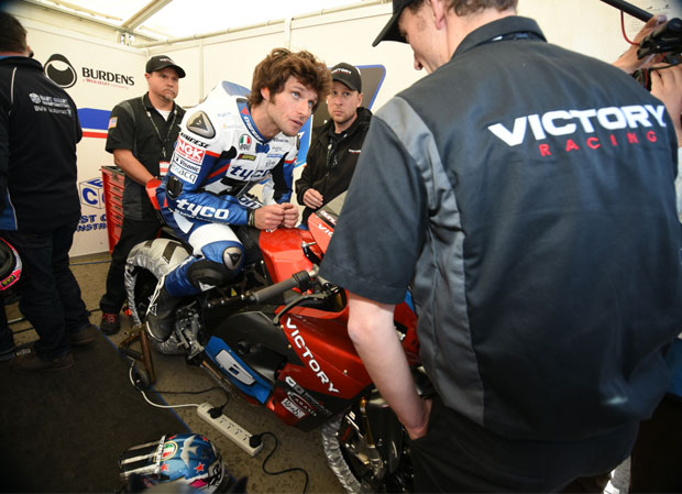 Guy gets briefed on riding the Victory electric motorcycle. Credit Dave Kneale