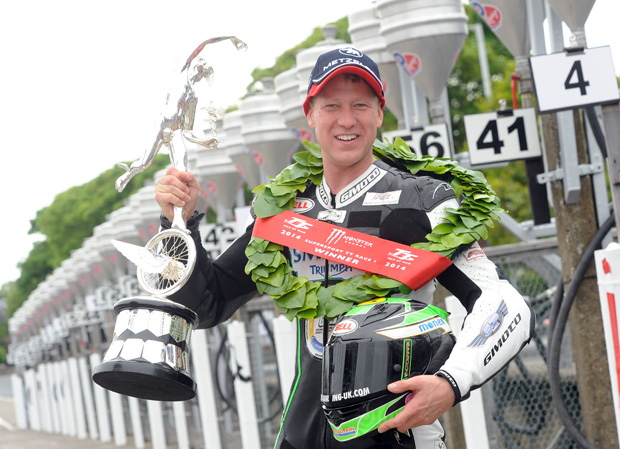Lincolnshire's Gary Johnson celebrates his second TT win following the 2014 Supersport TT race
