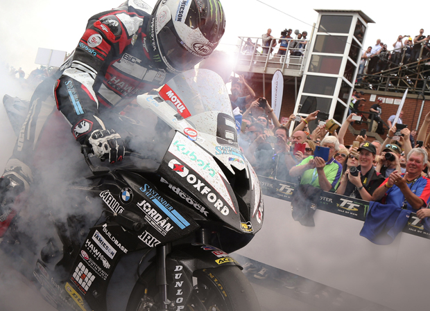 Michael Dunlop performs a burnout for the crowds as he wins the 2016 PokerStars Senior TT 