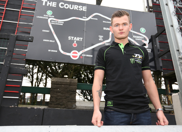 18-year-old Joe Thompson in front of the famous map of the Isle of Man TT Mountain Course