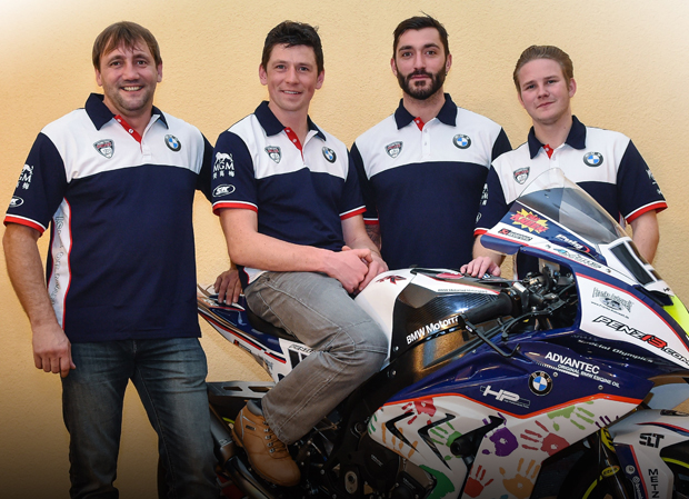 Team Principal Rico Penzkofer (left) with riders Dan Kneen (on bike), Alex Polita and Danny Webb