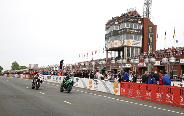 Horst Saiger and Derek Sheils race past the Main Grandstand during the 2016 PokerStars Senior TT