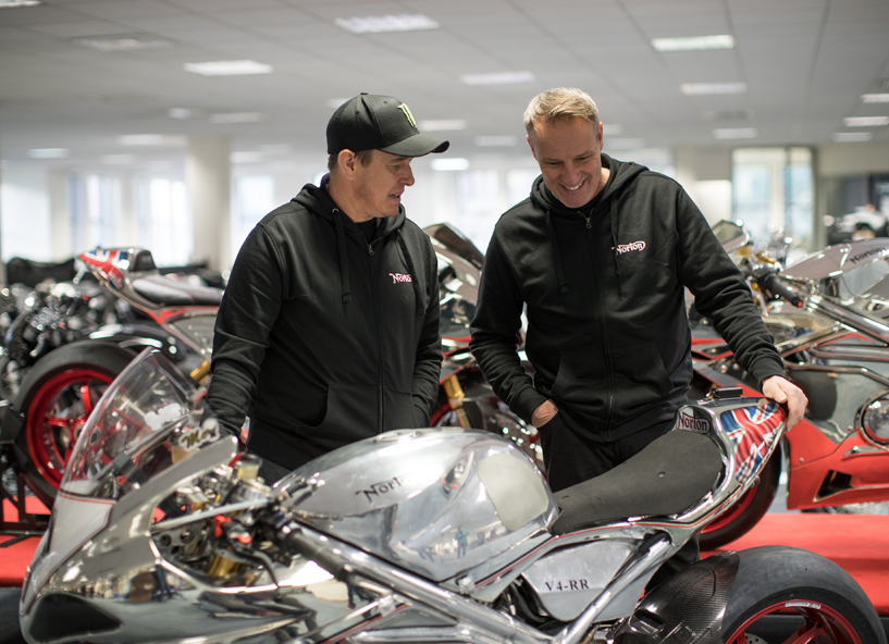 John McGuinness and Stuart Garner examine one of the Norton bikes at the company's HQ.