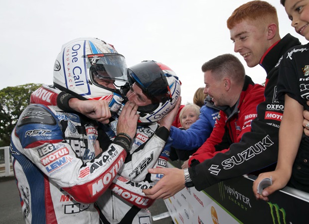 Ben and Tom Birchall celebrate their win in the Locate.im Sidecar TT Race 1