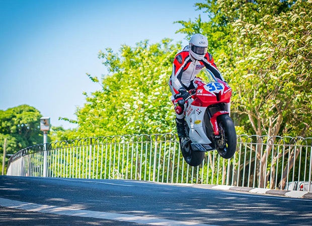 Michael Evans flies over Ballaugh Bridge in the 2018 Supersport TT Race. Photo by Sean Corlett