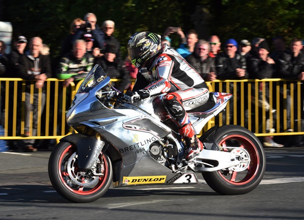 John McGuinness lands at Ballaugh Bridge on the Norton during Tuesday's qualifying session