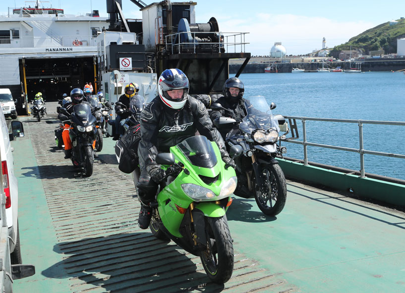 riders leave the Isle of Man Steam Packet Company's ferry in Douglas